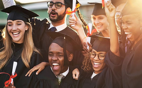 University students celebrating at graduation
