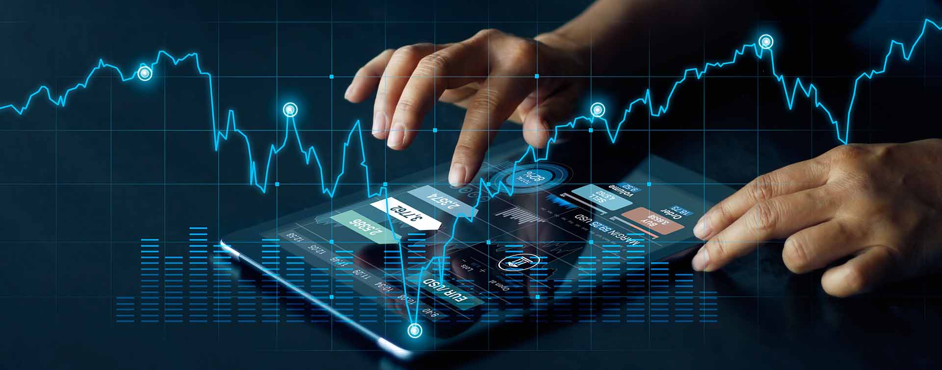 Businessman using tablet overlayed with investment graph