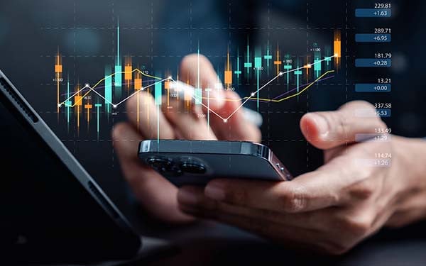 Investor analysis with stock exchange graph on screen