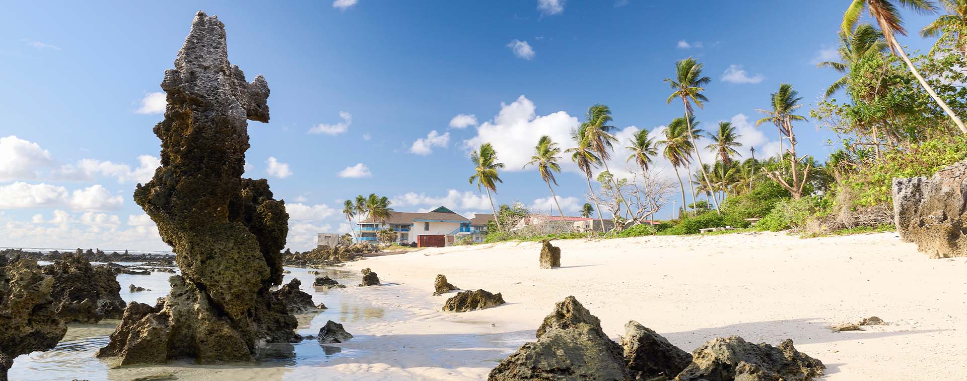 Nauru coast with beach house and rocky beach