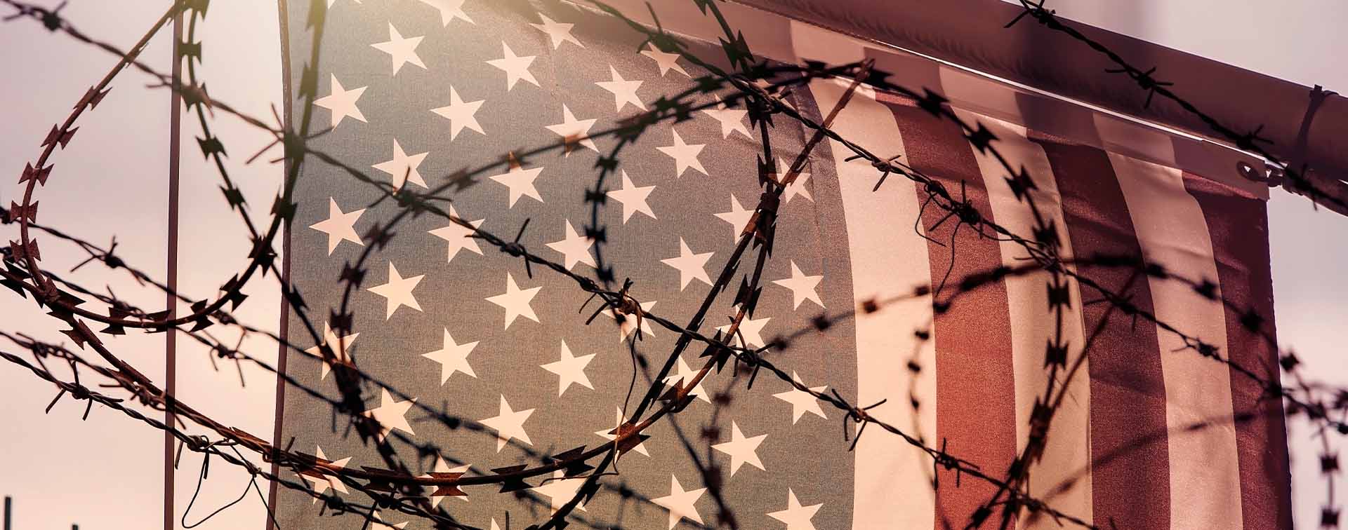 American flag and barbed wire, USA border